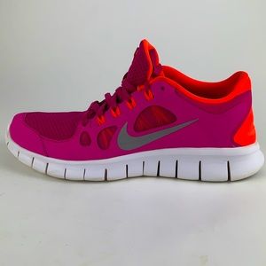 Nike free 5.0 sneakers. size 7y pink and orange.